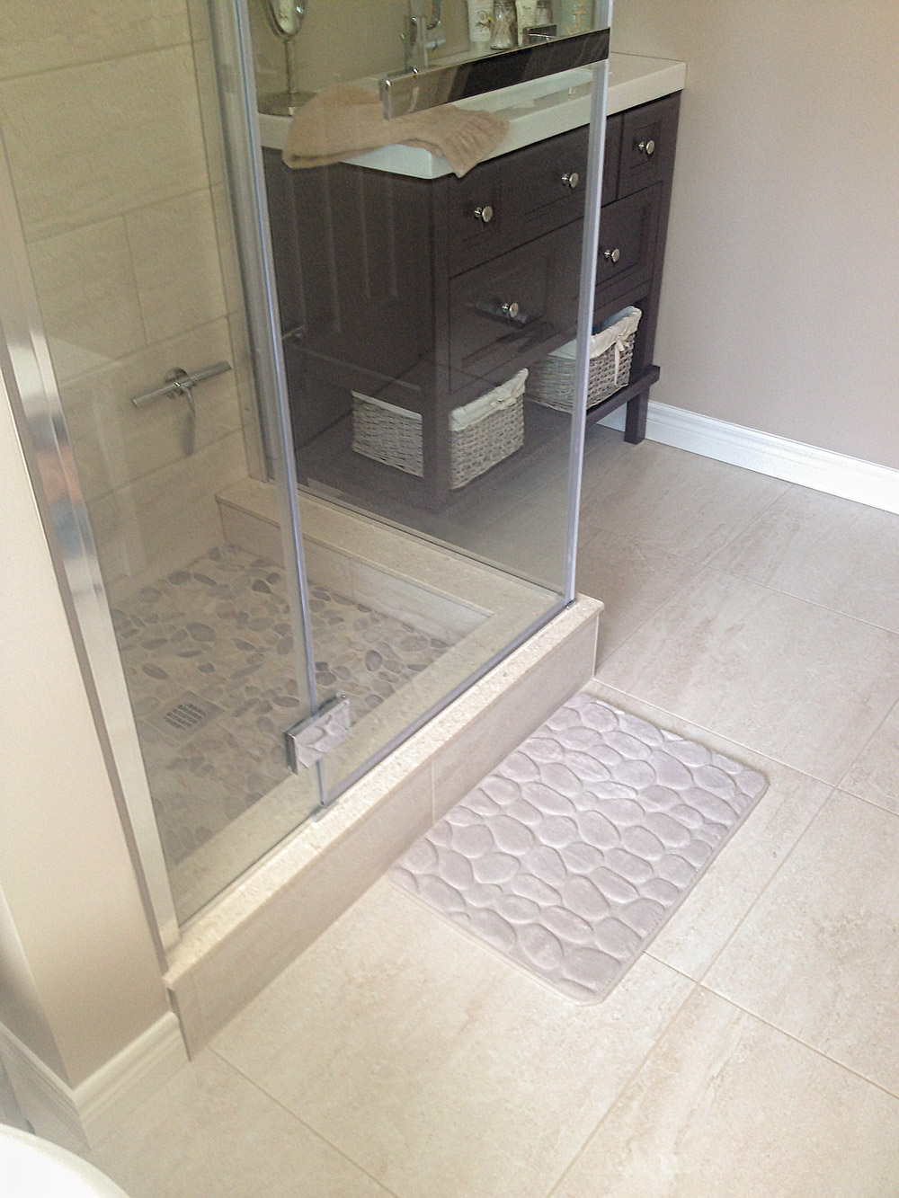 Custom tiled shower with Fleurco glass shower door in chrome.