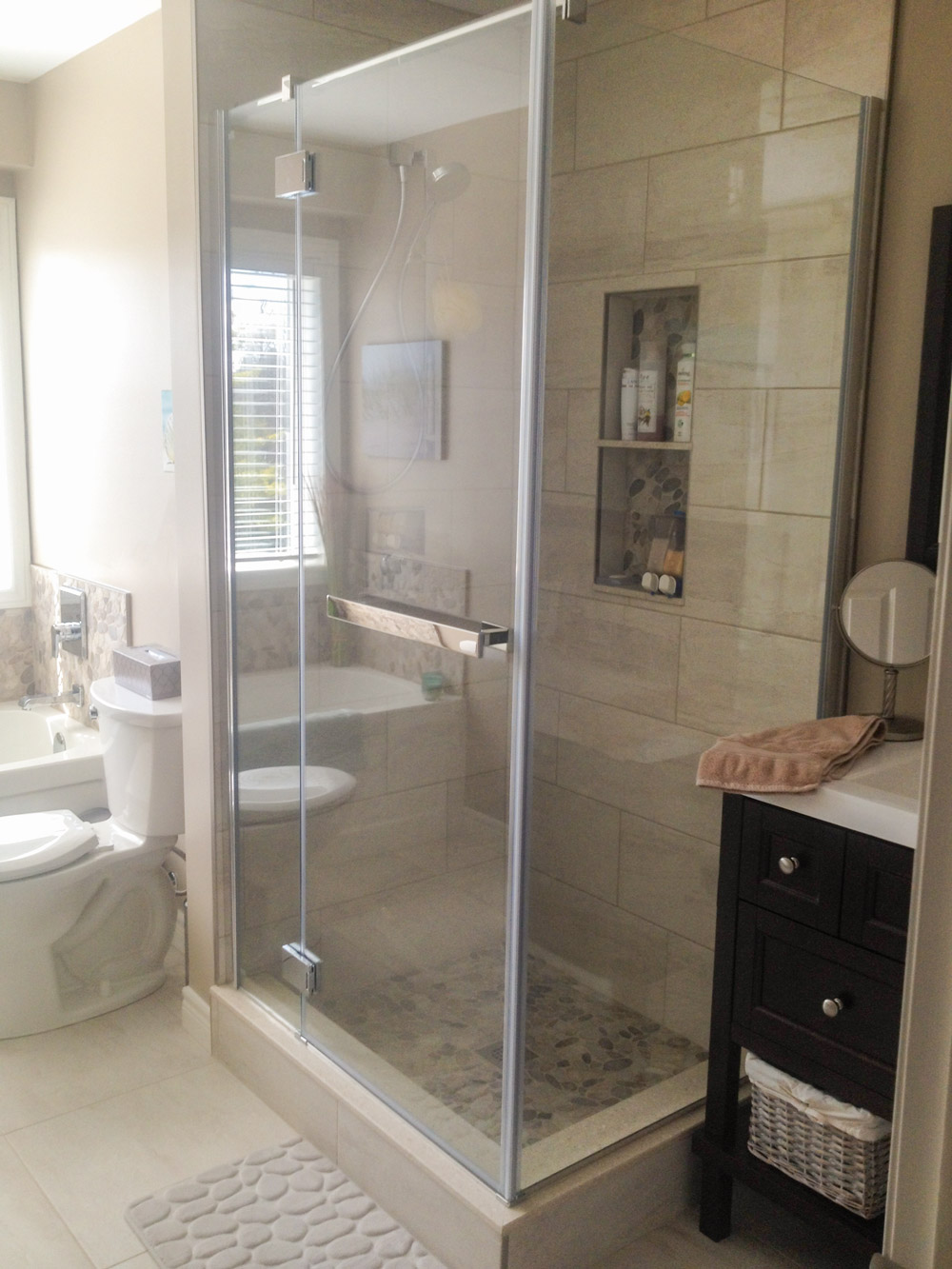 Custom tiled corner shower with Fleurco Shower Door in Chrome 